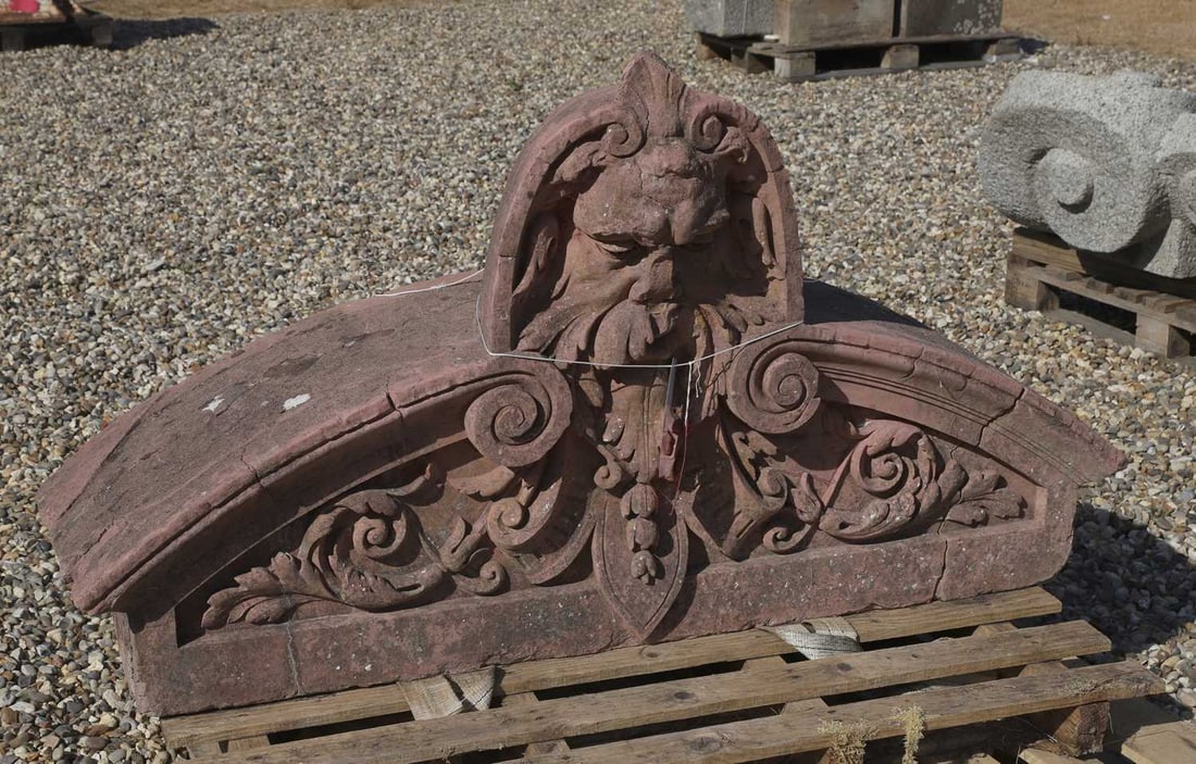 A Green Man fountain head, 19th century,: A Green Man fountain head, 19th century, terracotta over stone, profusley detailed, of a semi circular form with head as pediment 140cm wide, 37cm deep, 78cm high Condition Report: Would need