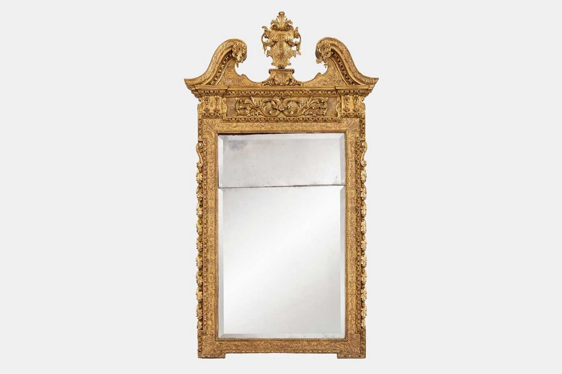 A George II giltwood and gesso mirror in the manner of William Kent, circa 1735 and later, (1 of 2)