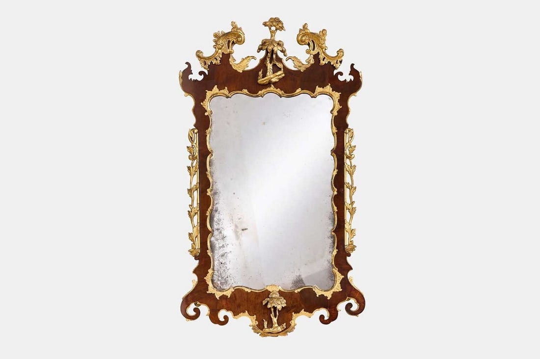 A George II walnut and parcel-gilt mirror, circa 1740, (1 of 2)