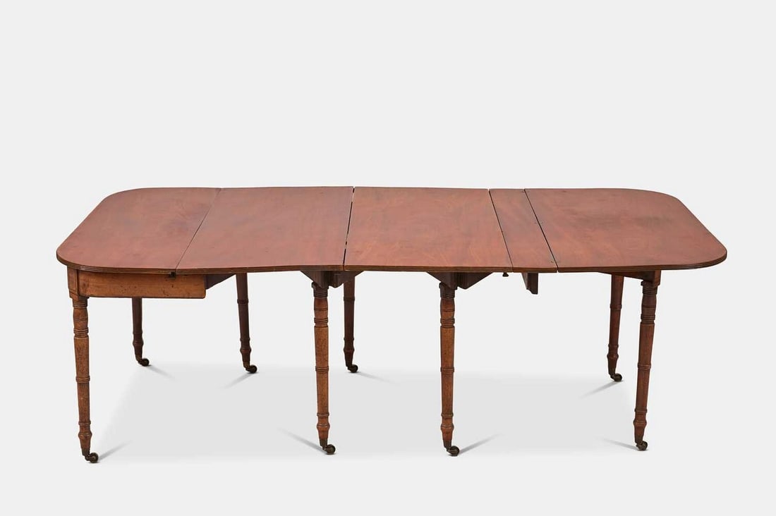 A Regency extending mahogany dining table, circa 1820, in the manner of William Wilkinson, (1 of 5)