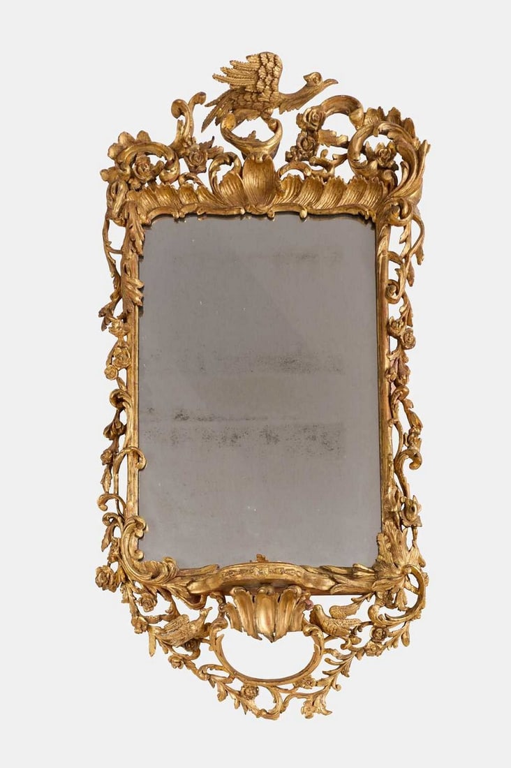 A carved giltwood mirror in the manner of Thomas Johnson, 19th century and later, (1 of 2)