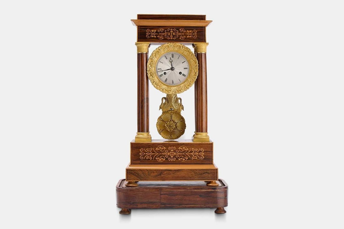 A Napoleon III rosewood, boxwood and ormolu portico clock, circa 1860, French,: A Napoleon III rosewood, boxwood and ormolu portico clock, circa 1860, French, of architectural form, housing a twin-train eight-day movement striking the hours and half hours on a bell, the silvered 