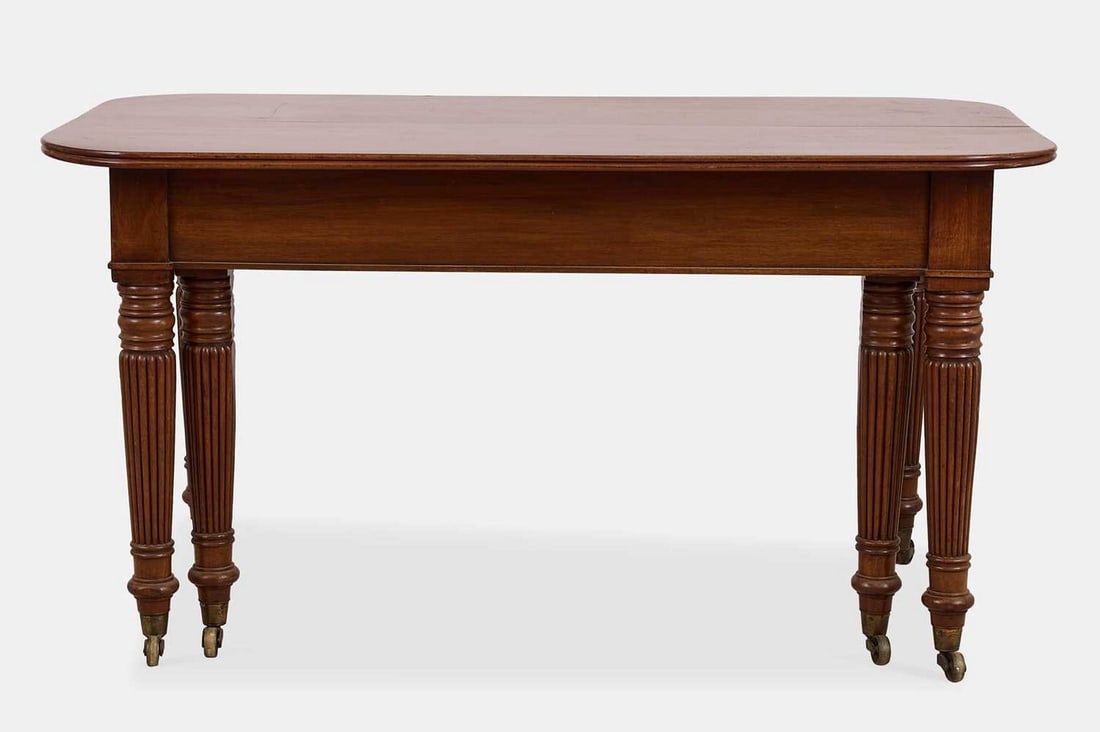 A George IV 'imperial' action extending mahogany dining table, circa 1830, in the manner of Gillows, (1 of 6)