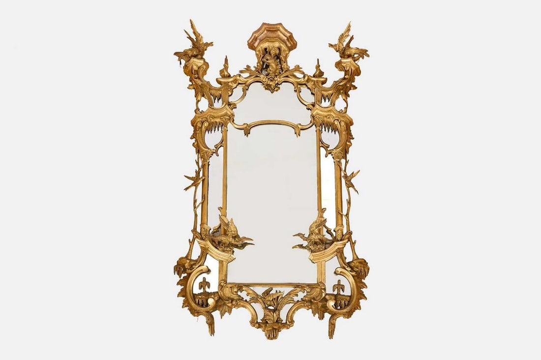 A George III-style carved giltwood pier mirror, 19th century, in the manner of Thomas Johnson, (1 of 2)