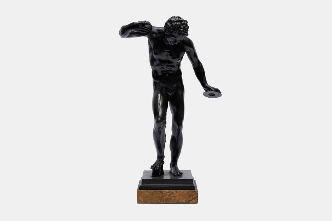 A grand tour bronze figure of The Dancing Faun, 19th century, Italian, after the antique,: A grand tour bronze figure of The Dancing Faun, 19th century, Italian, after the antique, mounted on a Siena marble plinth base (18cm wide, 12.5cm deep, 31cm high) Condition Report: Good condition ove