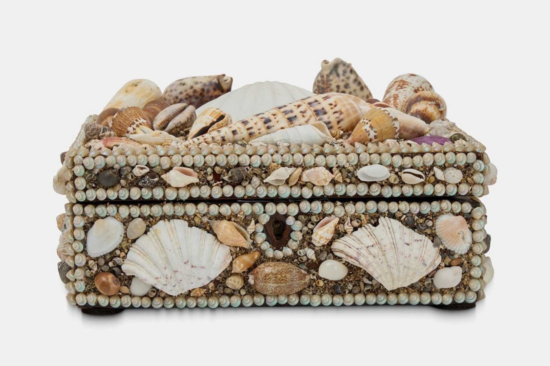 A shellwork box, 19th century, French,: A shellwork box, 19th century, French, with a hinged lid opening to reveal storage compartments (29cm wide, 26cm deep, 15cm high) Condition Report: Good condition overall. Hinges may benefit from tigh