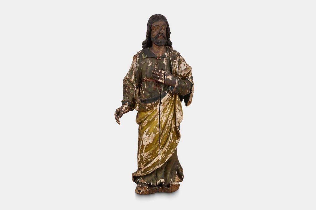 A carved and polychrome painted wooden figure, 18th century, Southern European,: A carved and polychrome painted wooden figure, 18th century, Southern European, depicting a saint (46cm wide, 29cm deep, 105cm high)