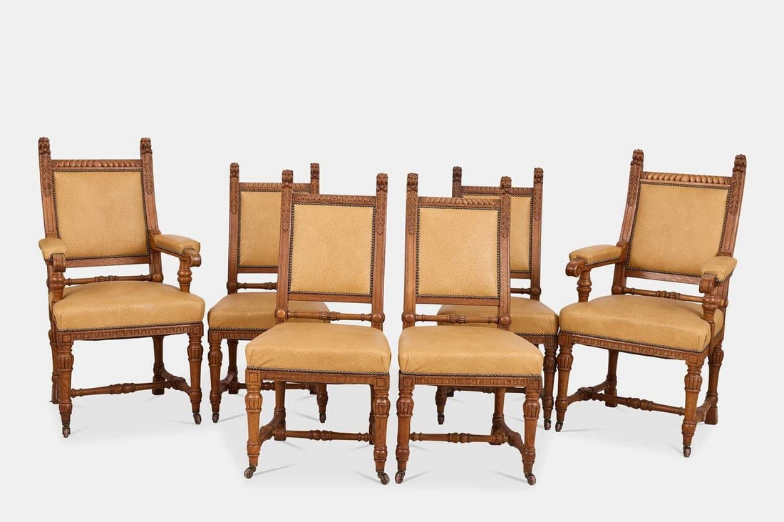 A set of six Renaissance Revival oak dining chairs, 20th century,: A set of six Renaissance Revival oak dining chairs, 20th century, comprising two armchairs and four side chairs, each upholstered in ostrich leather, the gadrooned top rail flanked by lion head termin