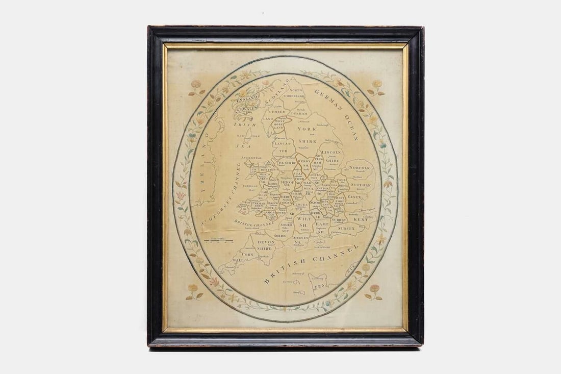 A Regency silkwork embroidered map of England and Wales, early 19th century,: A Regency silkwork embroidered map of England and Wales, early 19th century, worked by Elizabeth Coulson, depicting the counties of England and Wales, enclosed within an oval foliate border, inscribed