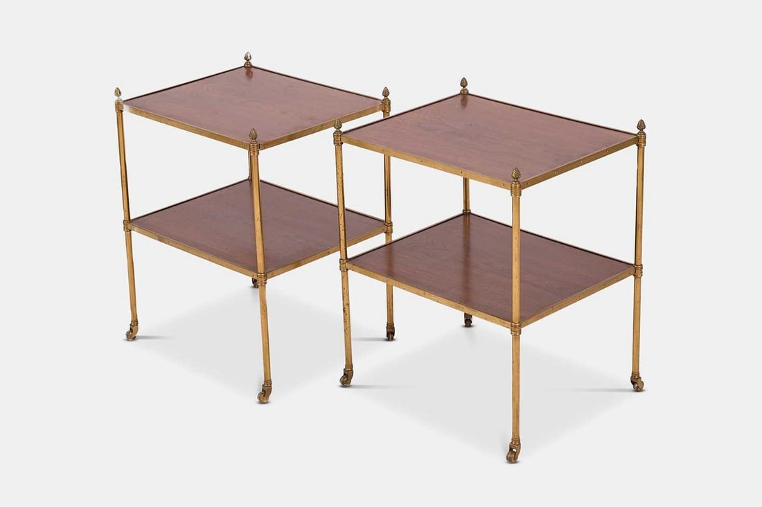 A pair of Regency-style rosewood and brass étagères, 20th century,: A pair of Regency-style rosewood and brass étagères, 20th century, each composed of two tiers, raised on tubular supports surmounted by acorn finials, and terminating in castors (51cm wide, 41cm dee