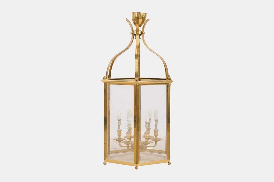 A large Regency-style brass and glass hall lantern, 20th century,: A large Regency-style brass and glass hall lantern, 20th century, of hexagonal form, with six arms issuing light bulbs, surmounted by scrolling supports terminating in a chalice finial, fitted for ele