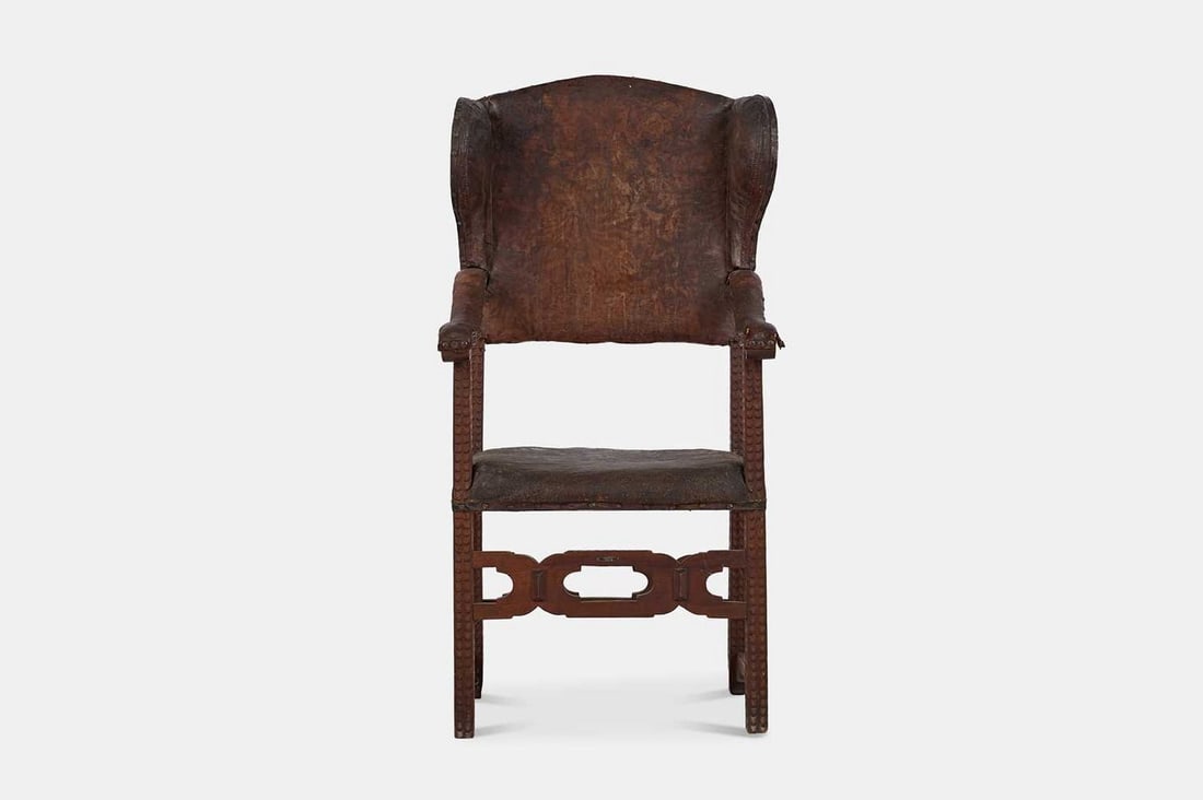 A walnut-framed leather wing armchair, 18th century, Spanish, (1 of 5)