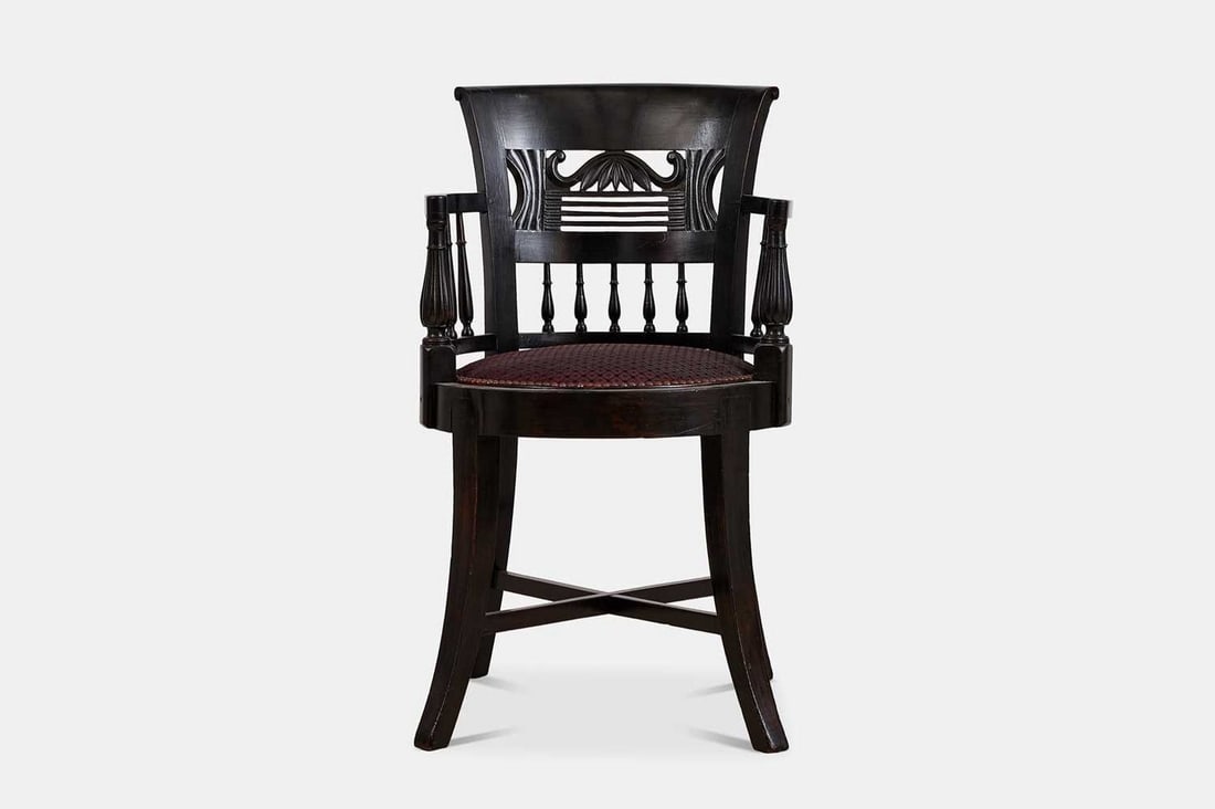 An ebonised hardwood armchair, late 19th century, probably Anglo-Indian or Anglo-Ceylonese, (1 of 6)