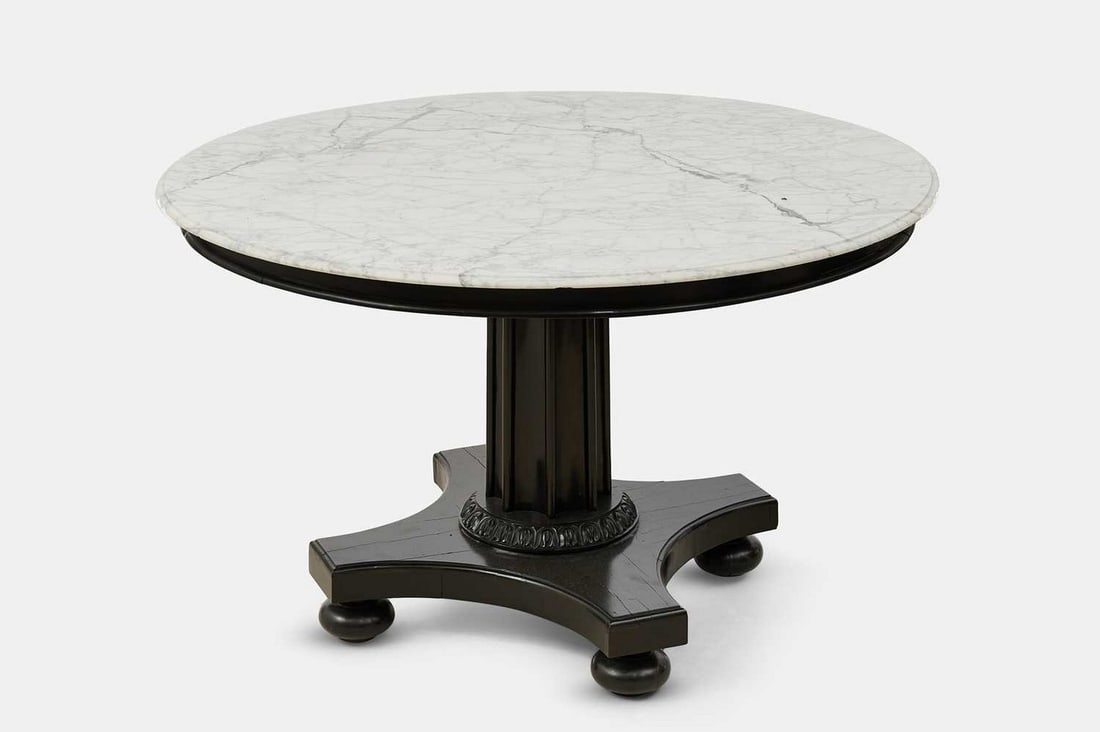 An ebony centre table, second quarter of the 19th century, Ceylonese, (1 of 3)