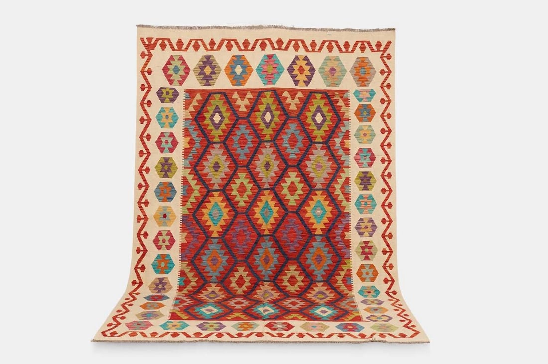A flat-weave wool carpet of Anatolian design, of recent manufacture,: A flat-weave wool carpet of Anatolian design, of recent manufacture, woven with repeating geometric motifs in polychrome tones (297 x 198cm) Condition Report: Overall the piece presents in very good s