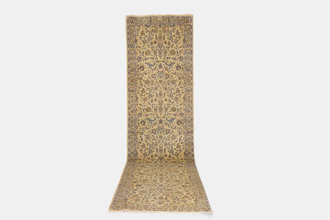 A Kashan wool runner, circa 1930, Persian,: A Kashan wool runner, circa 1930, Persian, woven throughout with foliate motifs to a pistachio field (446 x 113cm) Condition Report: Please note: although we try to reproduce colours as closely as pos