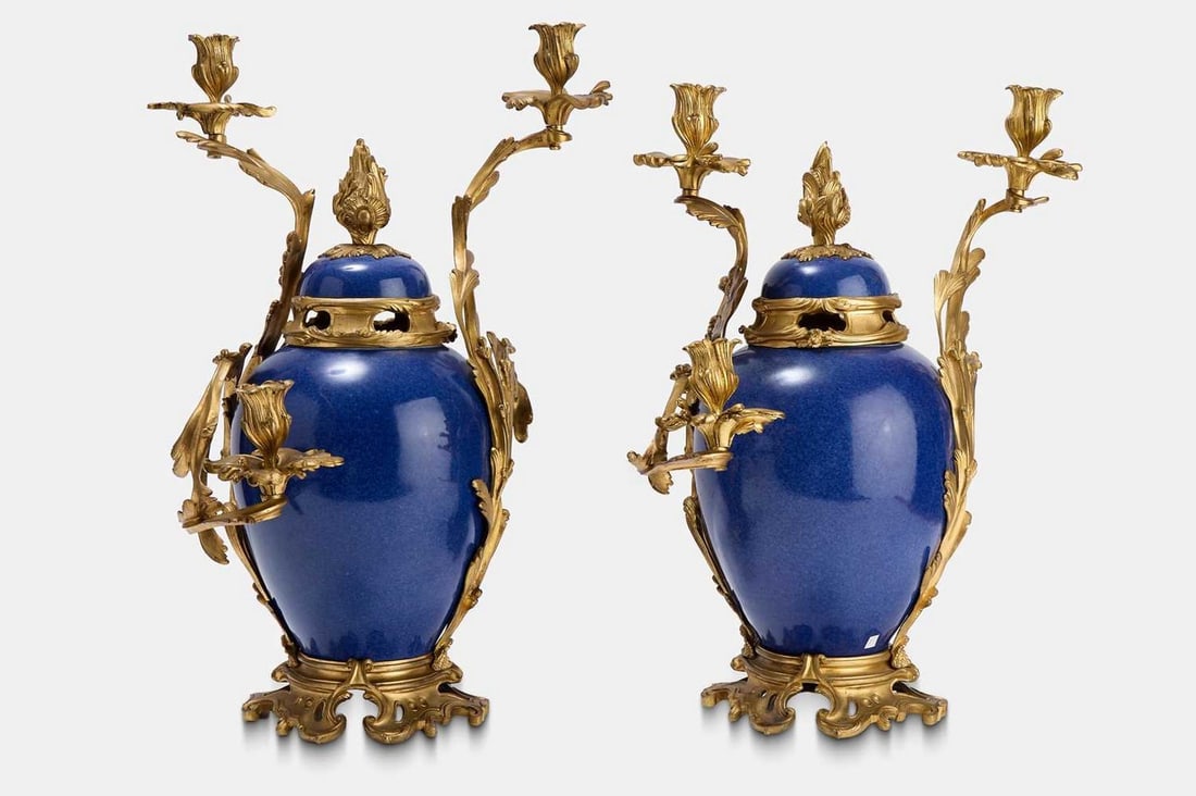 A pair of Louis XV-style cobalt-blue porcelain and ormolu candelabra, second half of the 19th: A pair of Louis XV-style cobalt-blue porcelain and ormolu candelabra, second half of the 19th century, French, in rococo taste, each with scrolling foliate arms terminating in candle nozzles, the dome