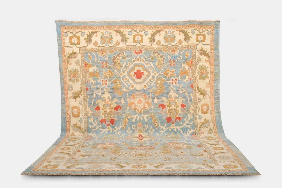 An Oushak wool carpet, of recent manufacture, (1 of 3)