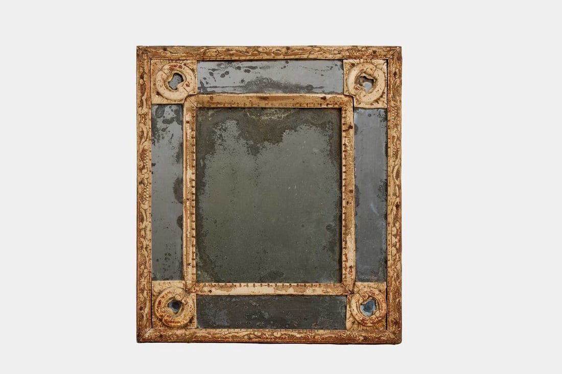 A painted mirror, early 19th century, Italian,: A painted mirror, early 19th century, Italian, the mercury glass margin plates enclosed within a carved guilloché frame (39cm wide, 3cm deep, 44cm high) Condition Report: General wear throughout,