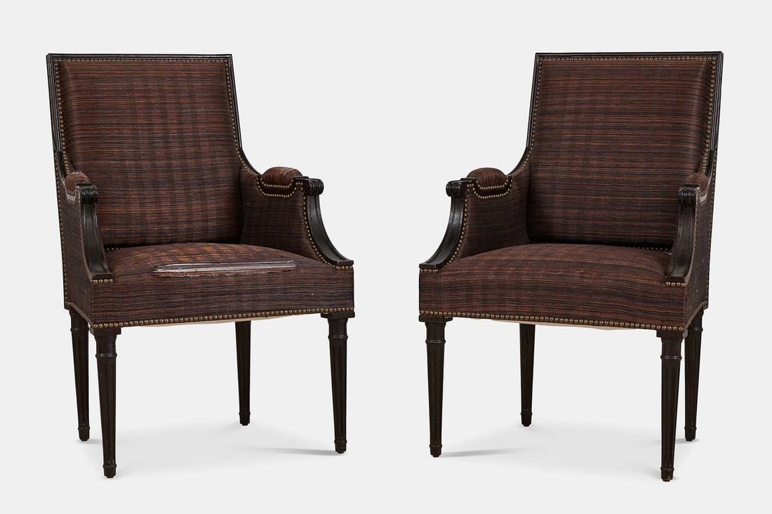 A pair of upholstered Louis XVI-style armchairs, of recent manufacture,: A pair of upholstered Louis XVI-style armchairs, of recent manufacture, each covered in plaid upholstery, with a square back over a wide stuffover seat, flanked by part-padded downscrolling arms, rais