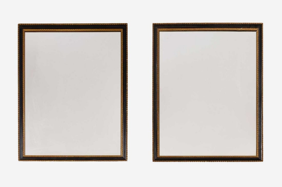 A pair of ebonised and parcel-gilt wooden wall mirrors, 20th century, (1 of 2)