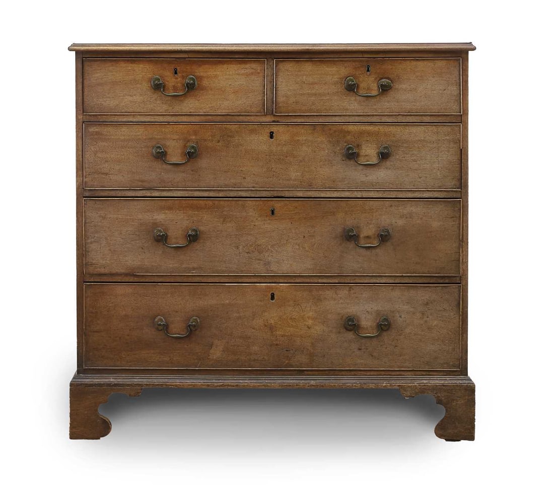 A George III mahogany chest of drawers, third quarter 18th century,: A George III mahogany chest of drawers, third quarter 18th century, the rectangular top above an arrangement of two short and three long drawers, raised on scalloped bracket feet 111cm wide, 57cm deep