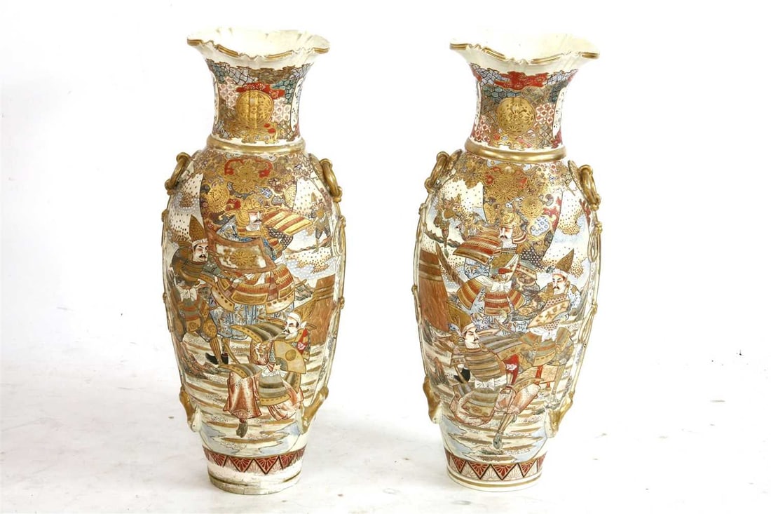 A pair of large Japanese satsuma pottery vases, 19th century,: A pair of large Japanese satsuma pottery vases, 19th century, each with flaring lobed rim, moulded braid handles to either side, and each decorated with samurai 78cm high Provenance: All porceeds