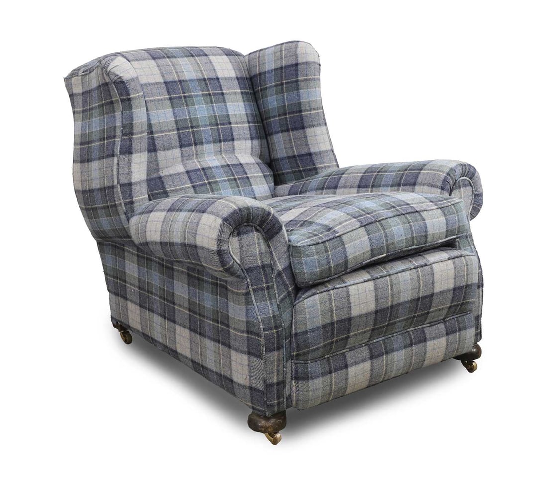 An upholstered club armchair, early 20th century,: An upholstered club armchair, early 20th century, covered in checquered wool fabric 97cm wide, 109cm deep, 92cm high Condition Report: One back castor replaced. General scuffs and wear to the