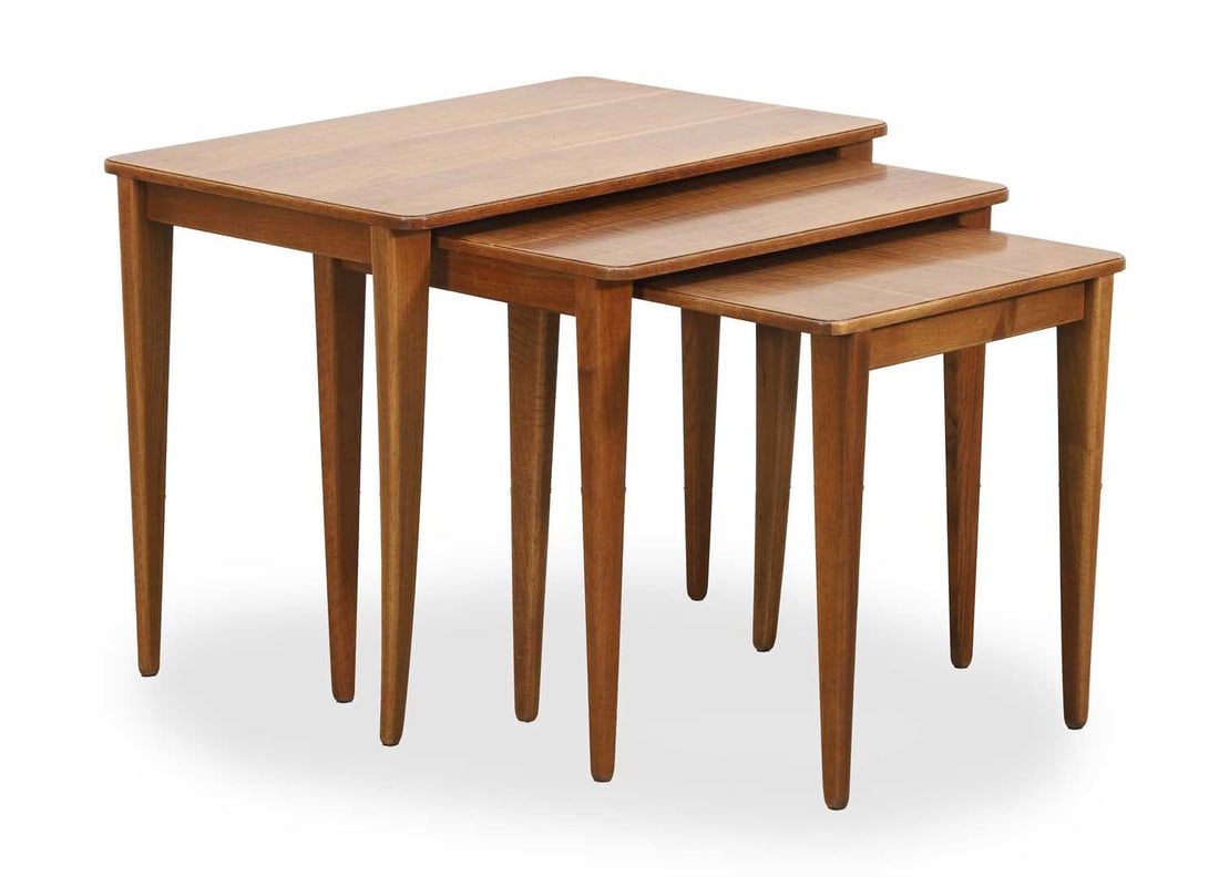 A Gordon Russell walnut nest of three tables, mid 20th century, (1 of 2)
