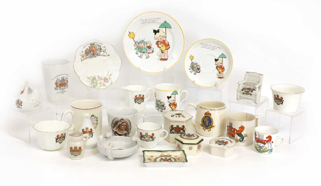 A Mabel Lucie Attwell trio, and a collection of Cambridge armorial items, circa 1900: A Mabel Lucie Attwell trio, and a collection of Cambridge armorial items, circa 1900 and various Royal commemorative mugs qty Condition Report: Various damages and cracks to the crested items