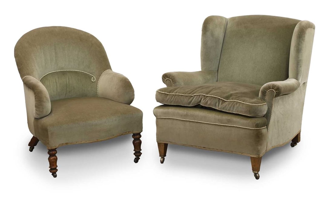 A Edwardian wing armchair in the manner of Howard and Sons, circa 1900,: A Edwardian wing armchair in the manner of Howard and Sons, circa 1900, with sqaub cushions and square tapering legs, together with a Victorian nursing chair 81cm wide, 89cm deep, 87cm high 2