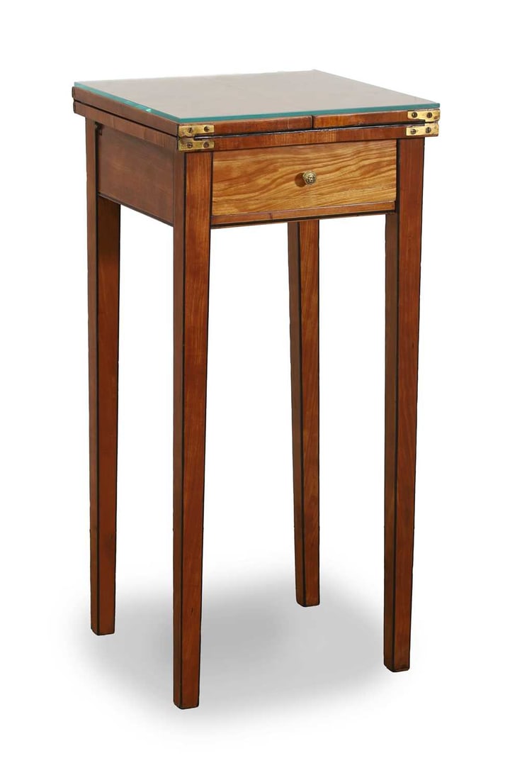 A George III style satinwood side table, early 20th century,: A George III style satinwood side table, early 20th century, with fold out top, single central drawer with lions mask brass handle, over tapering square legs 34.5cm wide, 74cm high