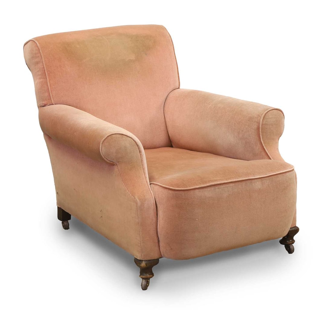 A velvet-upholstered club armchair, late 19th century / early 20th century,: A velvet-upholstered club armchair, late 19th century / early 20th century, on beech legs with ceramic castors 88cm wide, 114cm deep, 80cm high Condition Report: The fabric stained in many