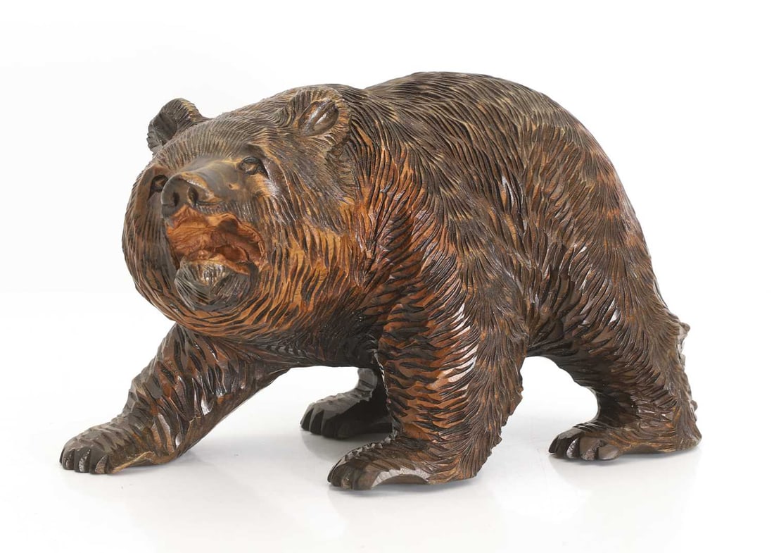 A black forest-style carved wooden bear, 20th century, (1 of 2)