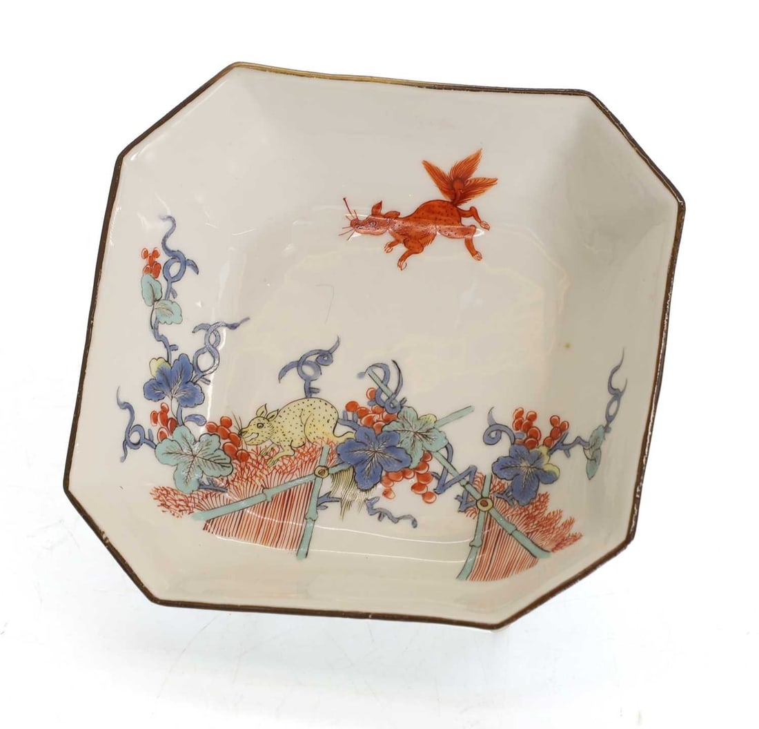 A Meissen dish 18th century,: A Meissen dish 18th century, in the Kakiemon taste, underglazed crossed swords marks 11 x 10cm Condition Report: Brown rim, with chips otherwise fine.