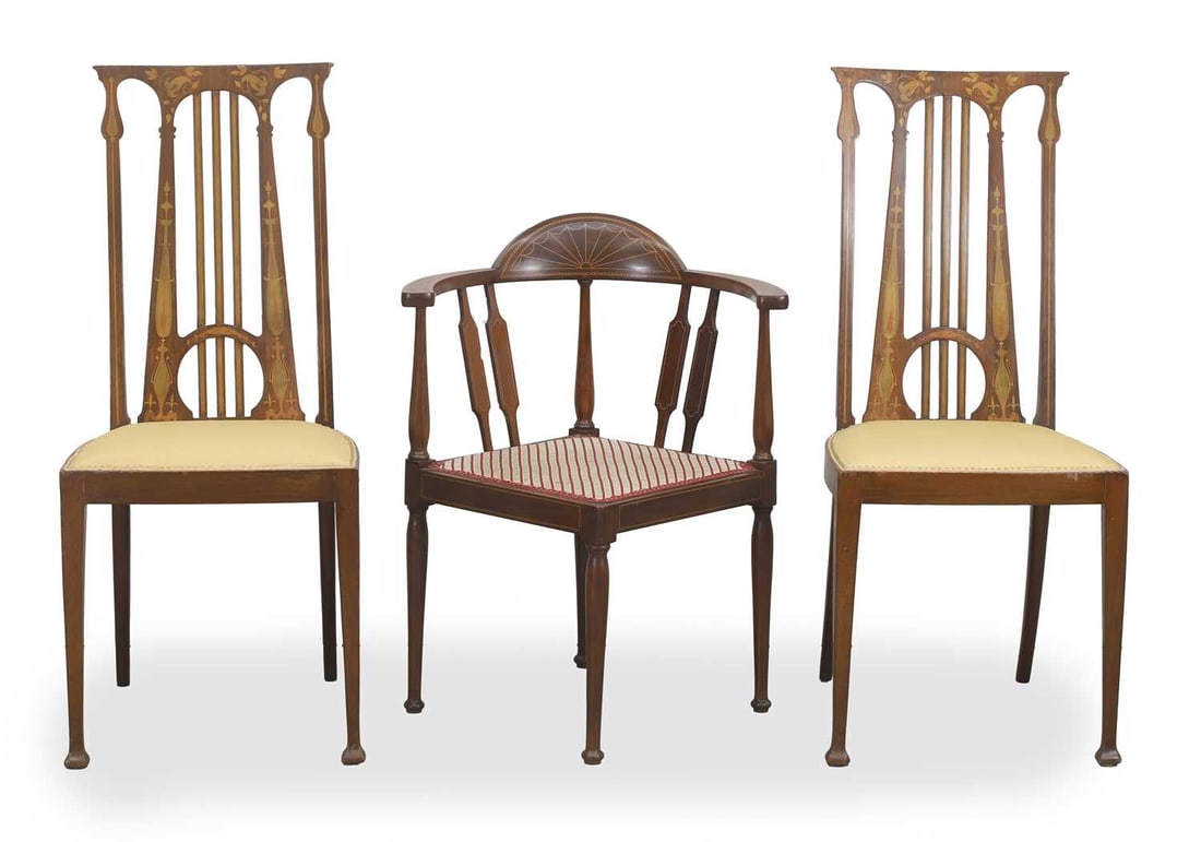 A pair of inlaid mahognay hall chairs, c.1900,: A pair of inlaid mahognay hall chairs, c.1900, inlaid with Art Nouveau inspired details and pierced harp backs, with mustard coloured stuff over seats, together with an inliad mahognay corner chair
