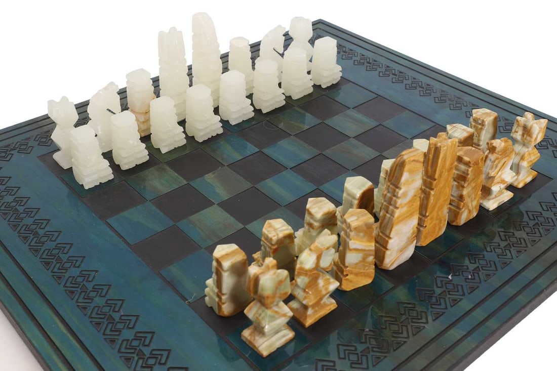 An Aztec style calcite and onyx chess board, late 20th century, - 2