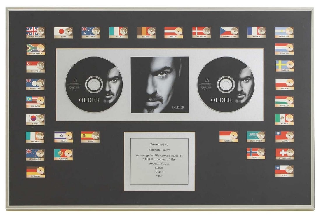 A presentation CD, George Michael, 'Older',: A presentation CD, George Michael, 'Older', mounted with the flags of thirty-two named countries and a presentation plaque inscribed 'Presented to Siobhan Bailey to recognise worldwide sales of 5,000,