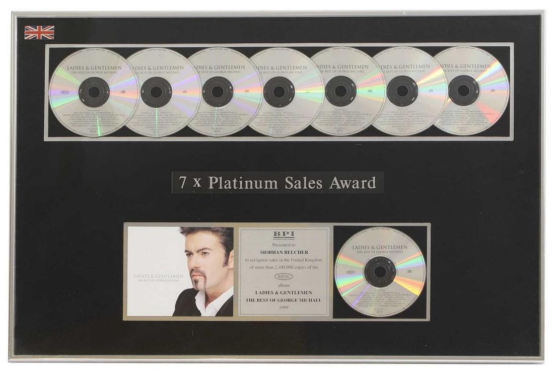 7-platinum sales award, George Michael, 'Ladies & Gentlemen: The Best of George Michael',: 7-platinum sales award, George Michael, 'Ladies & Gentlemen: The Best of George Michael', seven mounted CDs over an inscription and a plaque, flanked by a CD and sleeve, inscribed 'Presented to