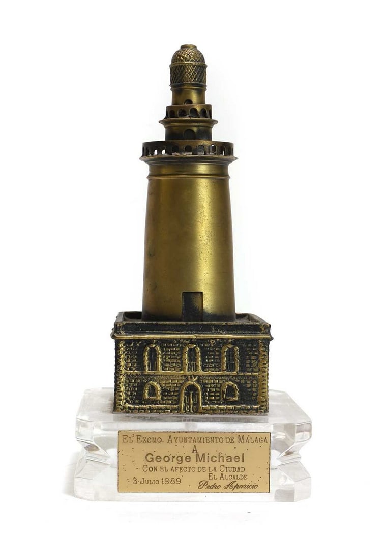 An award from Malaga City Council to George Michael, in the form of a brassed-metal lighthouse, (1 of 3)