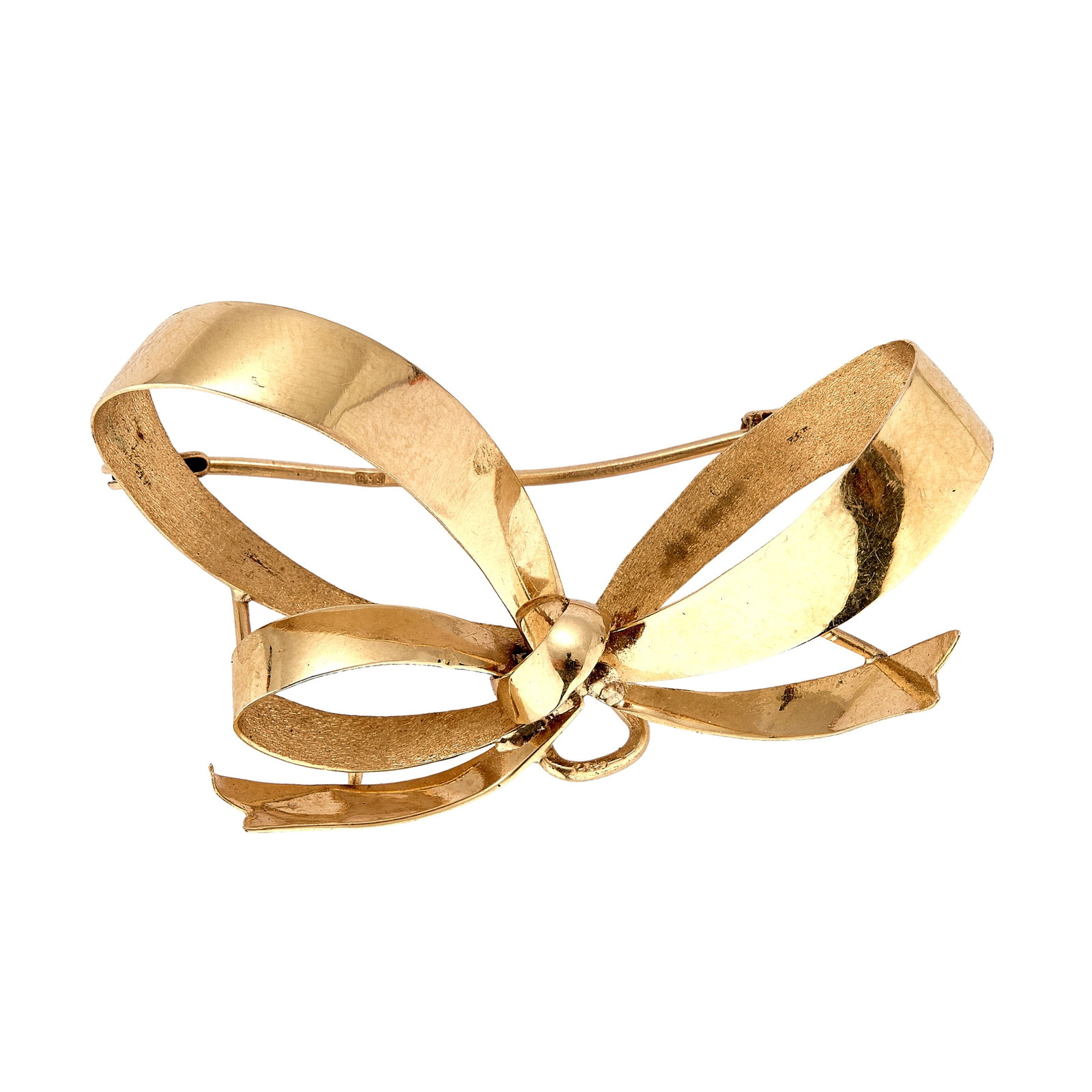 A 14ct gold bow brooch,: A 14ct gold bow brooch, of three dimensional ribbon form to a pin and trombone clasp with pendant hook, hallmarked 585 London import marks 1987 (Width 4.3cm; 3.9g) Condition Report: Scratches and