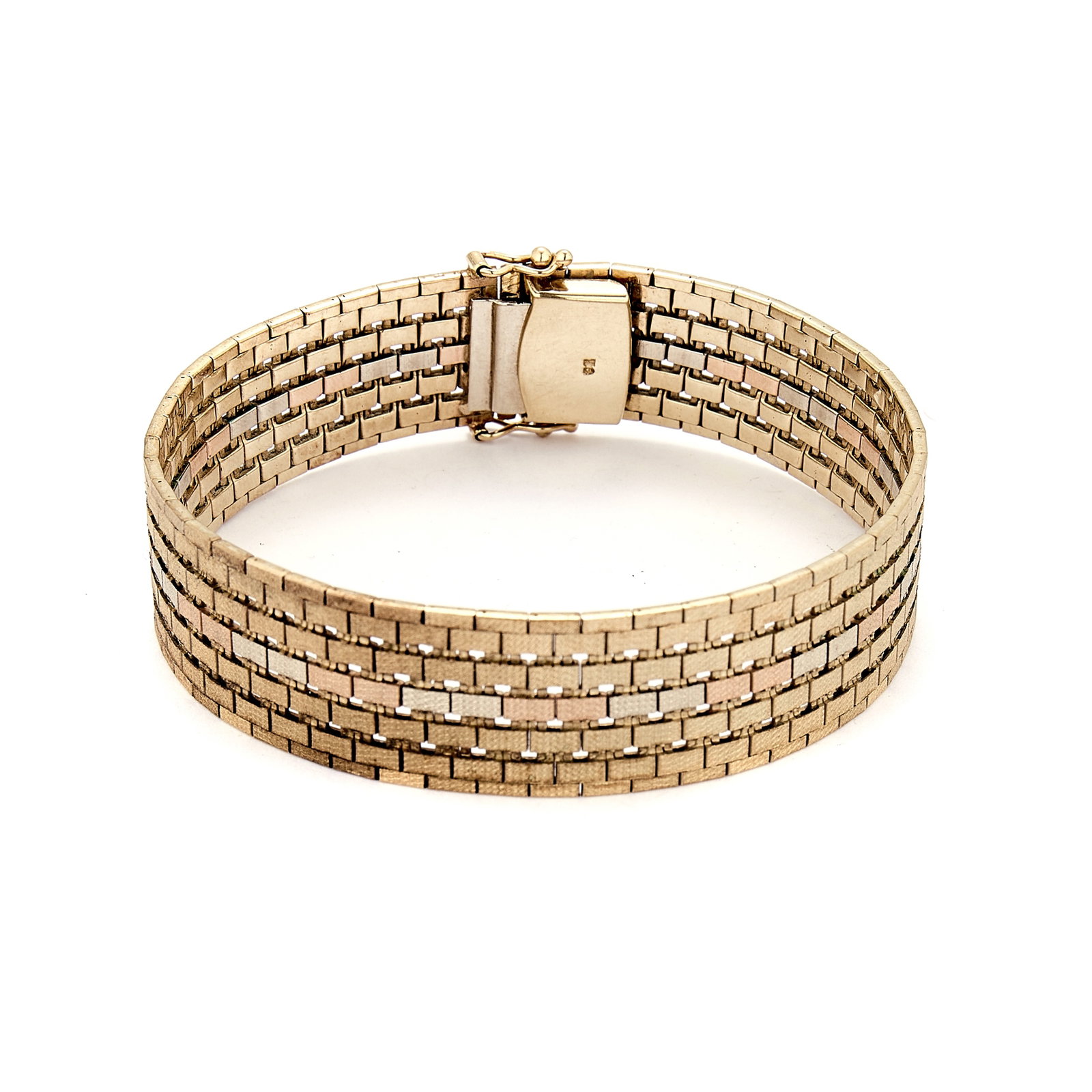 A 9ct tricoloured gold strap bracelet, 1970s,: A 9ct tricoloured gold strap bracelet, 1970s, of textured brick link design, with a central band of rose and white gold links, sponsor mark CJ, London import hallmark, 1978 (Length 18.7cm; 30.3g)