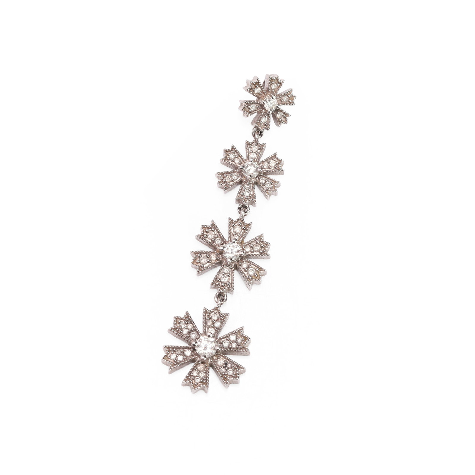 A diamond set drop pendant,: A diamond set drop pendant, composed of four graduating and articulated stylised snowflakes with concealed bail, stamped 14k, tested as approximately 14ct gold (Length 5cm; 6.3g) Condition Report: