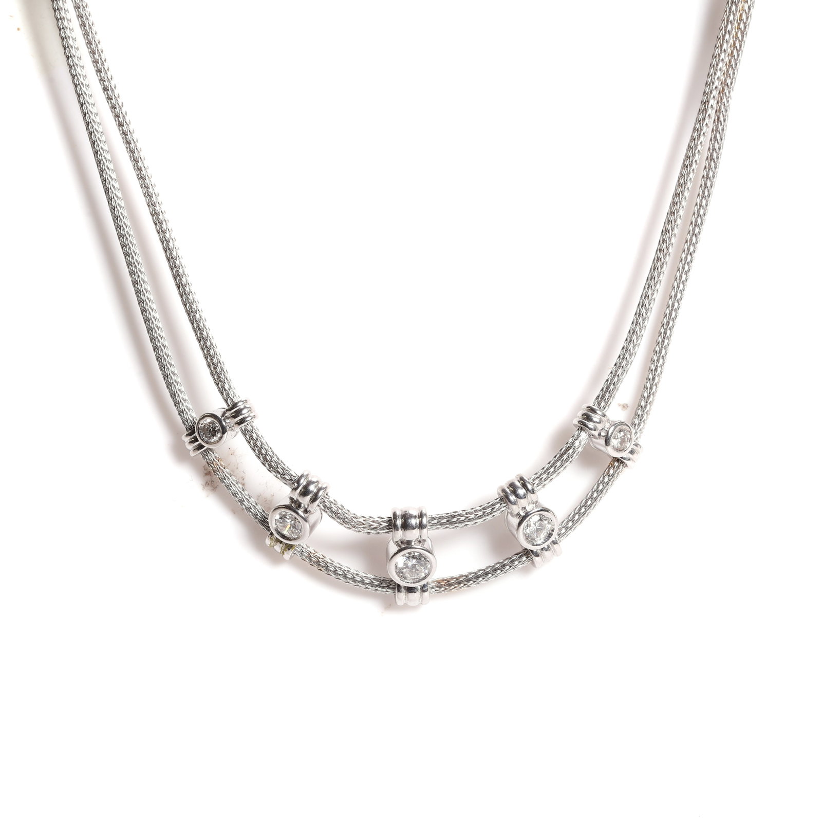 A double row diamond set choker,: A double row diamond set choker, composed of two strands of snake chain, separated to the front with five rub over set graduated round brilliant cut diamond spacers, to a box clasp with diamond set