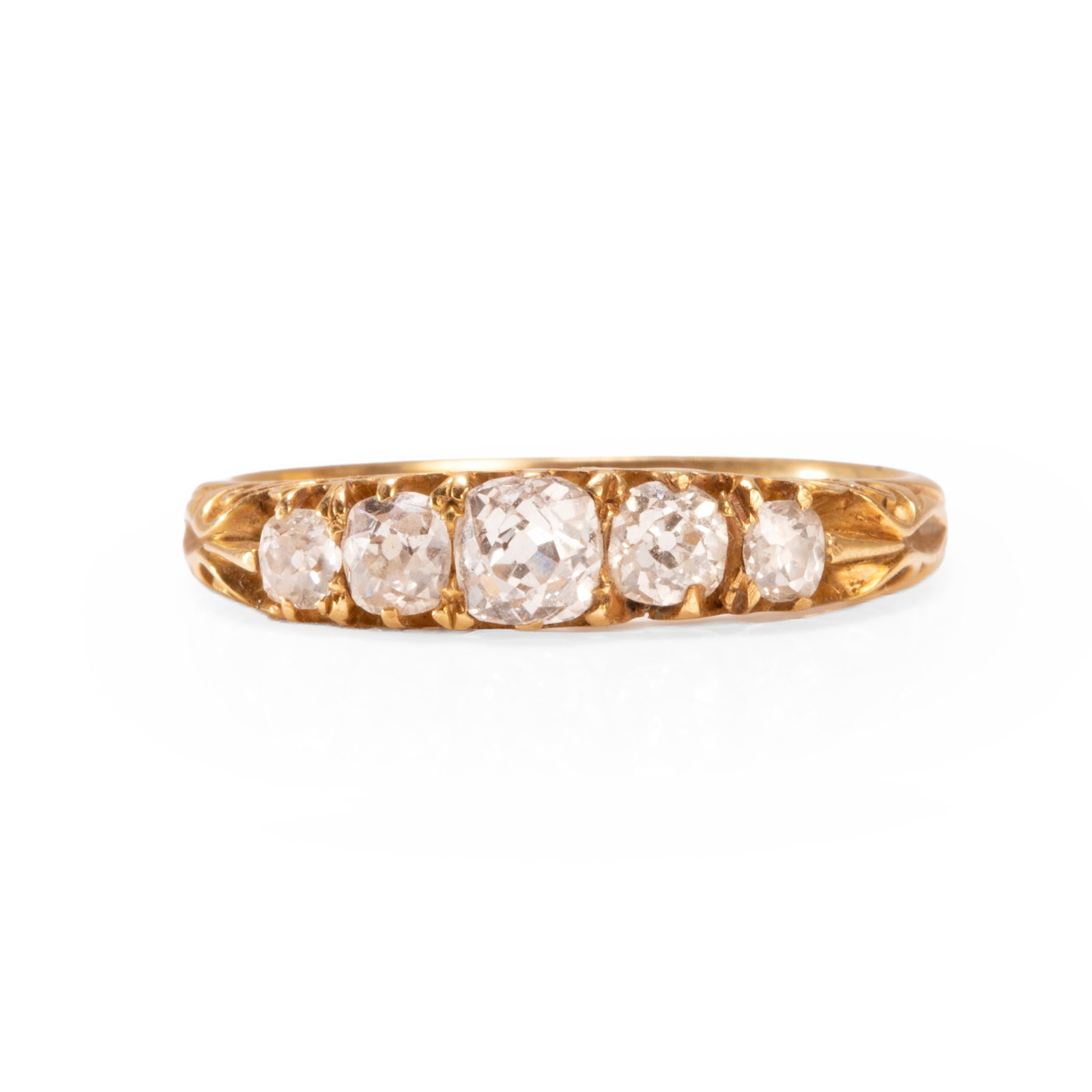 A five stone diamond ring,: A five stone diamond ring, comprising five graduating old cut diamonds, set to a carved half hoop mount, unmarked, tested as approximately 18ct gold (Ring size O; 2.9g) Footnote: Buying this diamond