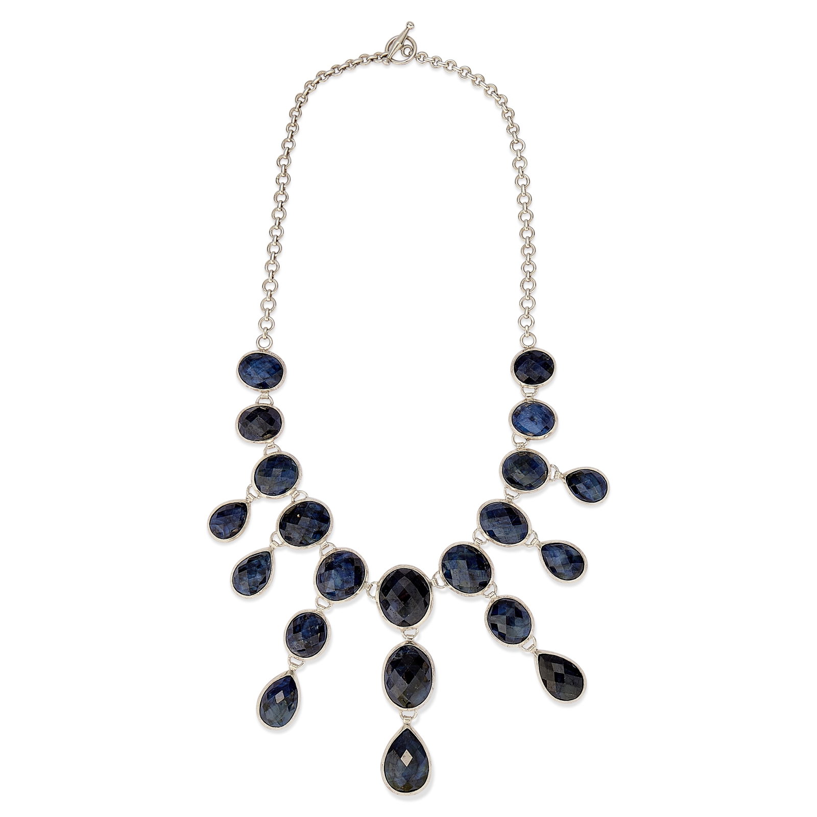 A silver and sapphire bib necklace,: A silver and sapphire bib necklace, bezel set with a fringe of oval and pear chequerboard cut sapphires, to a cable link back chain and 'T' bar clasp, London 2023 (Length 50.5cm; 126.1g) Condition Rep
