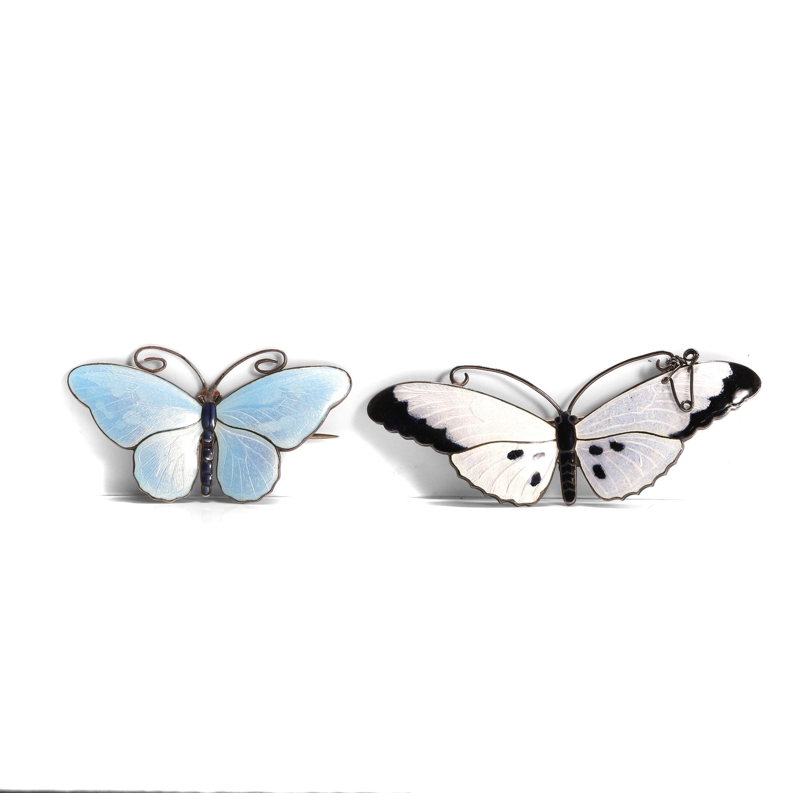 Two silver enamel butterfly brooches,: Two silver enamel butterfly brooches, comprising a silver gilt blue enamel butterfly brooch by Marius Hammer, signed, stamped Sterling 930S, and a sterling silver dark blue and white enamel example,
