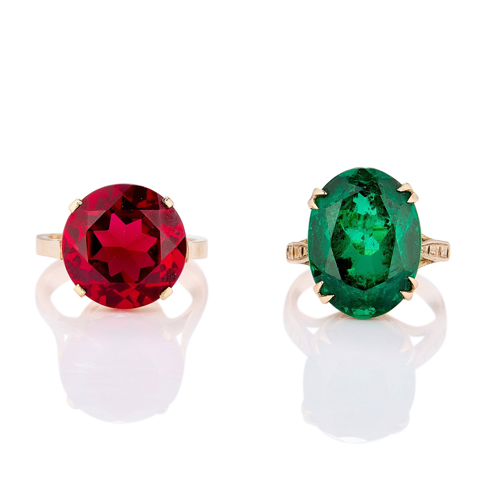 A 9ct gold green synthetic spinel ring and a synthetic ruby ring,: A 9ct gold green synthetic spinel ring and a synthetic ruby ring, the oval green synthetic spinel set with four split claws to a pierced collet and tapered 'D' profile band with incised detail to