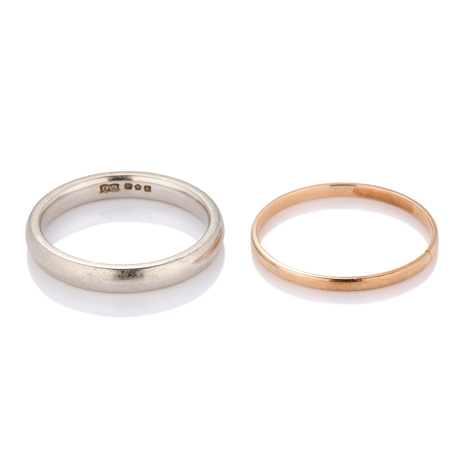 A platinum band and a plain band,: A platinum band and a plain band, the 'D' profile platinum band hallmarked Sheffield 1997 and the plain 'D' profile band unmarked, tested 14ct gold (4.8g) (2) Condition Report: Platinum band 4.2g.