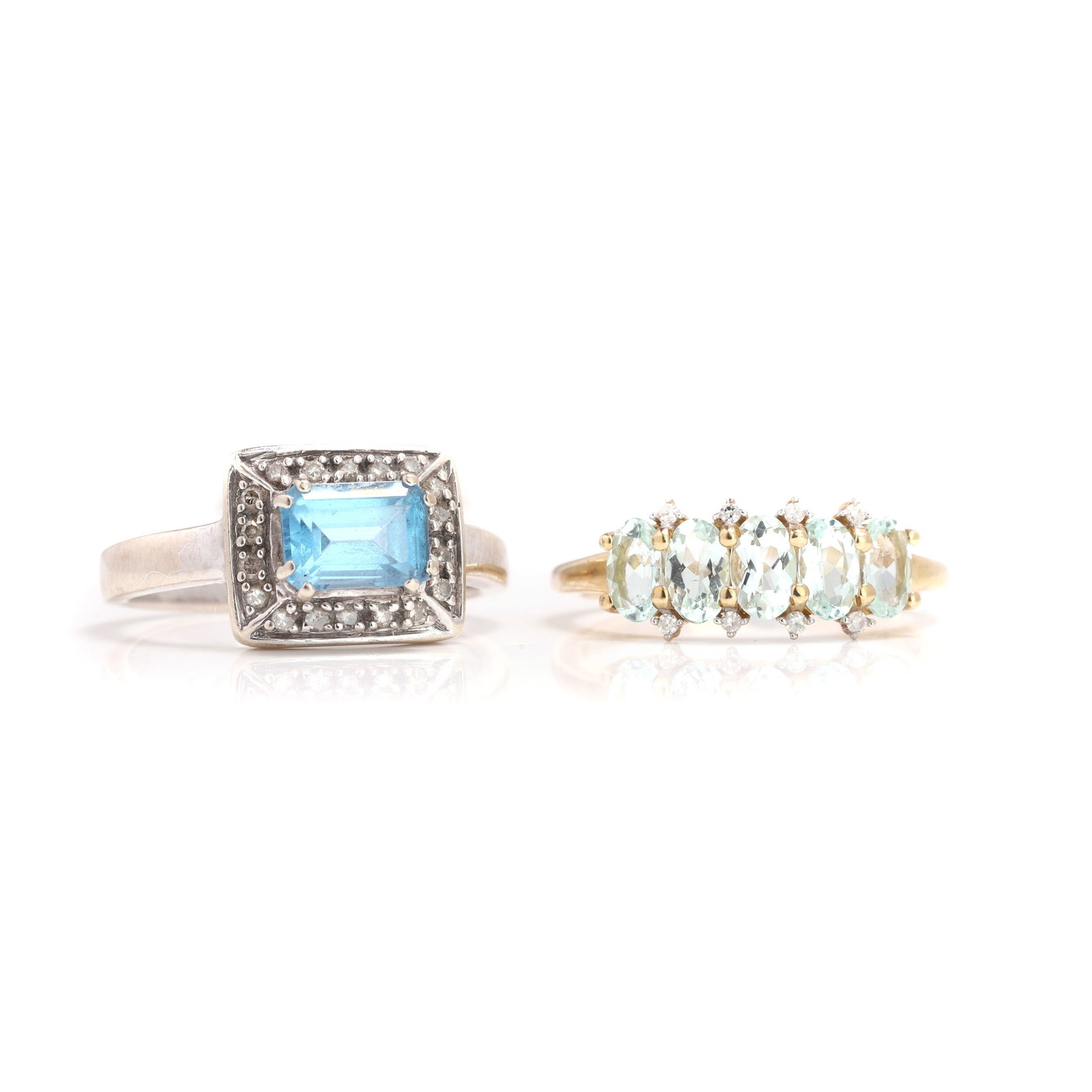 Two 9ct gold gemstone and diamond set rings,: Two 9ct gold gemstone and diamond set rings, comprising a five stone aquamarine ring with diamond accents, and a white gold blue topaz and diamond cluster ring, both hallmarked 375 (Total weight 4.7g)